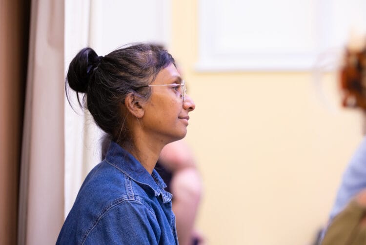 A student engaged in yoga therapy training