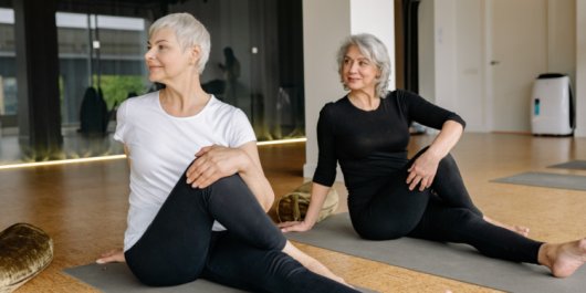 Older adults participating in yoga, a practice increasingly studied within longevity science and healthy ageing research.