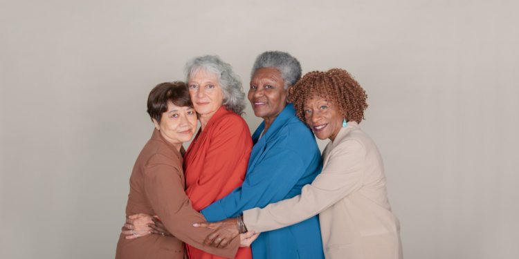 A group of ladies practicing yoga asana to illustrate hormetic stress and biological age reversal to demonstrate he hallmarks of ageing
