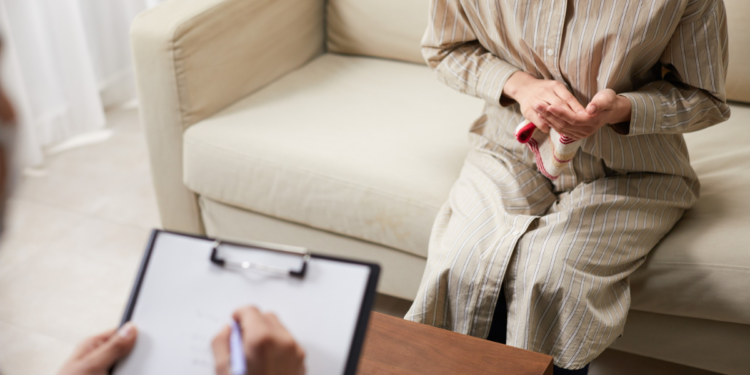 Cancer patient practising yoga as part of supportive oncology care recommended by consensus guidelines.