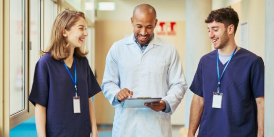 Doctor and yoga therapist collaborating to integrate yoga into evidence-based healthcare.