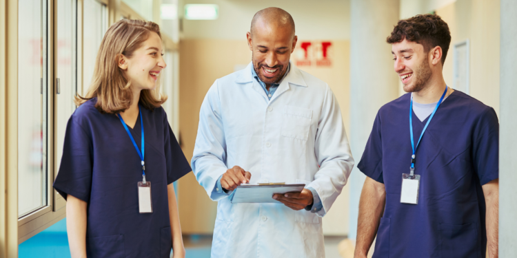 Doctor and yoga therapist collaborating to integrate yoga into evidence-based healthcare.
