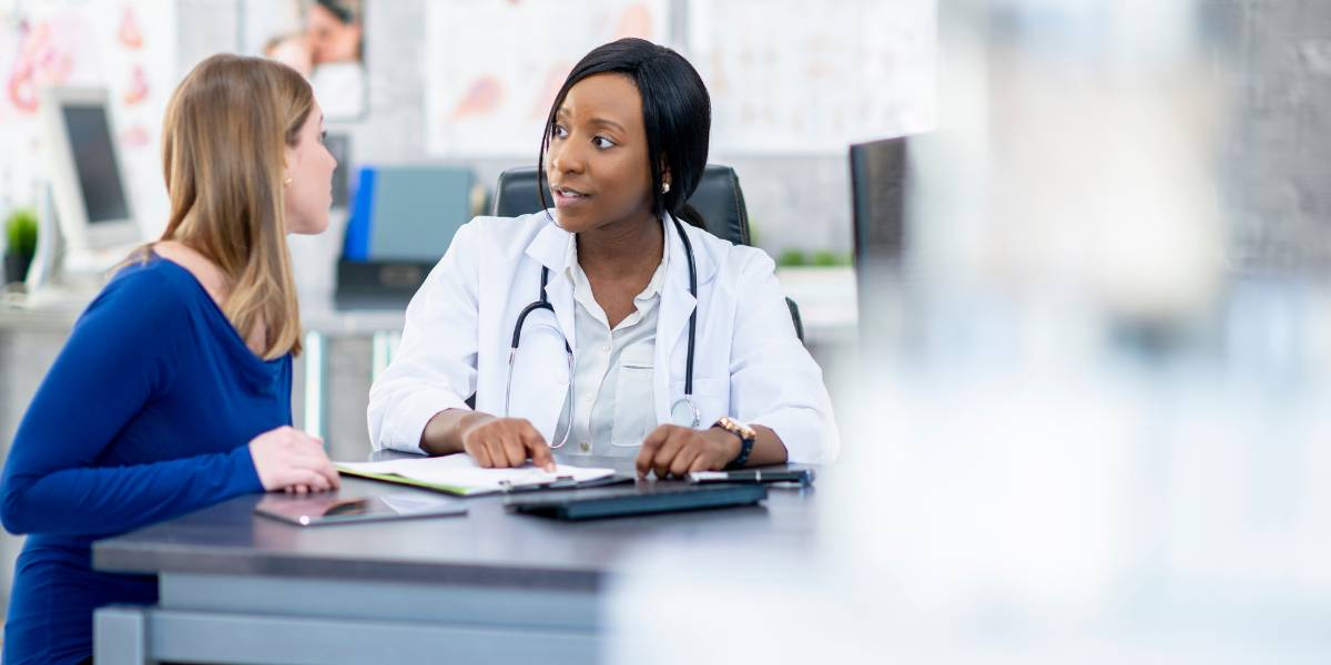 A doctor discussing consensus guidelines with a patient